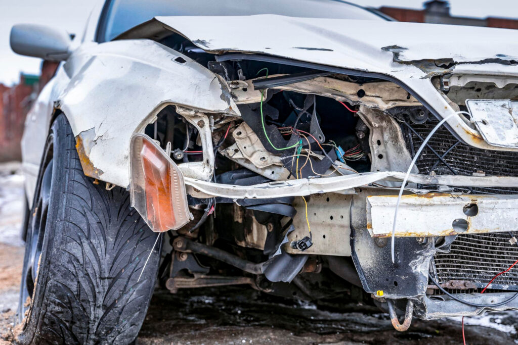 Wrecked car with damaged headlights