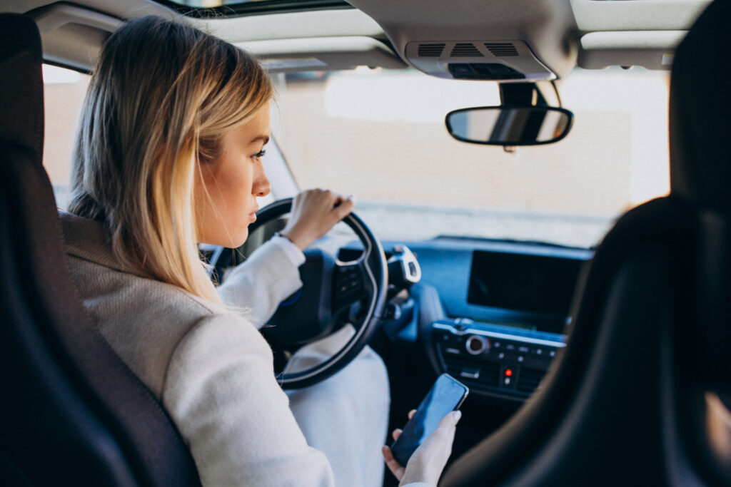 Woman sitting inside car