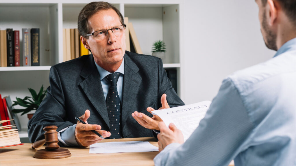 Lawyer discussing contract with client