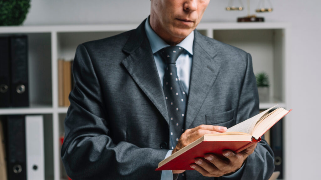 Lawyer reading book in the courtroom