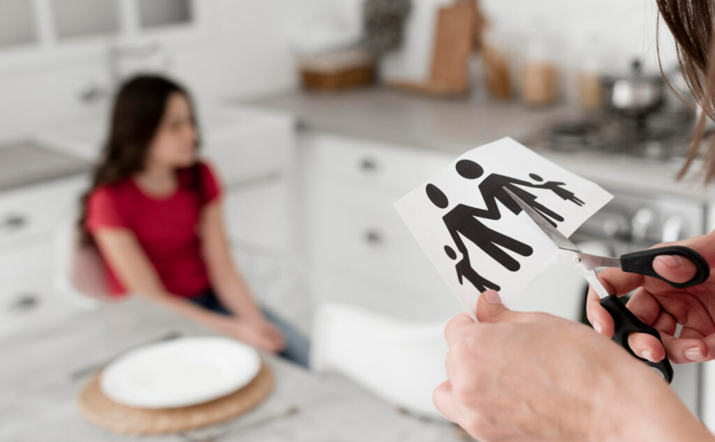 Parent cutting paper family with scissors