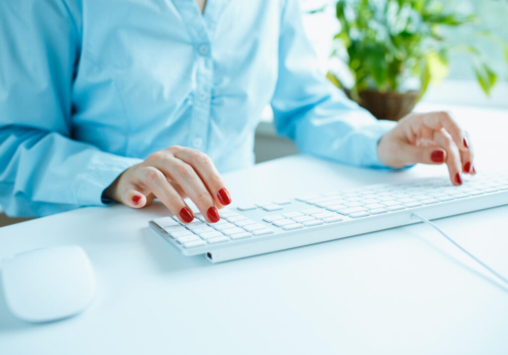 Worker typing on the keyboard