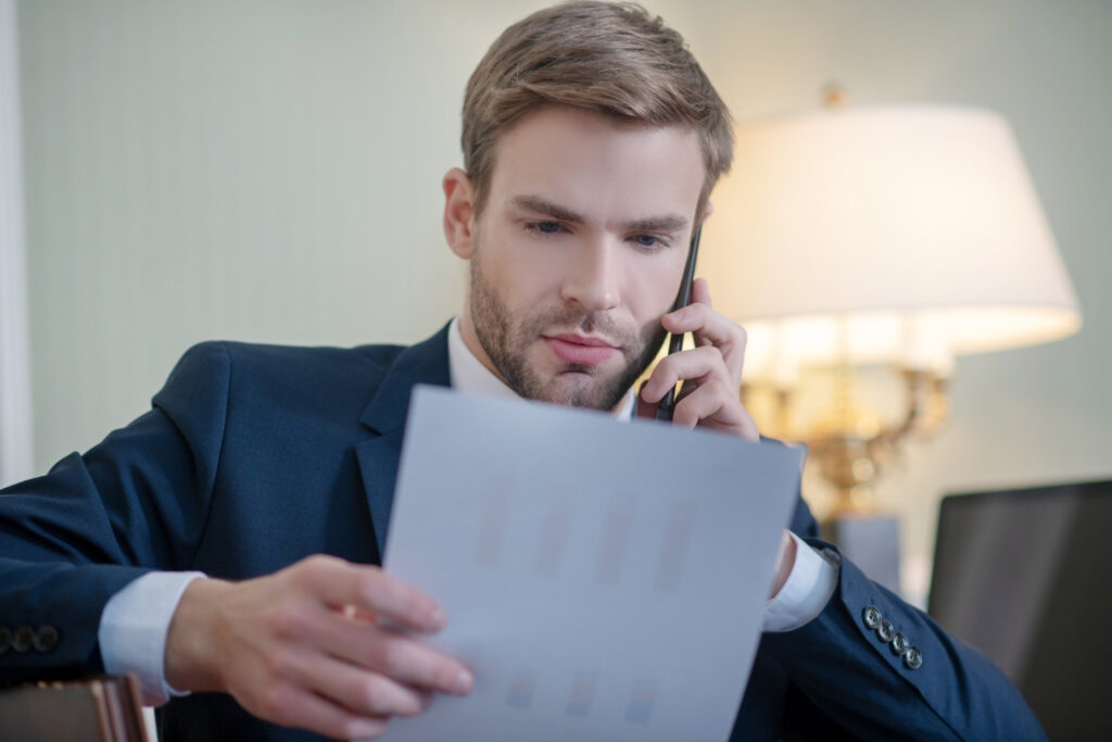 A man reading a business report 